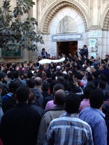 The body of Mohamed Youssry Salam, surrounded by hundreds of mourners in Alexandria, his hometown (Photo: Al-Dostour hand-out) 