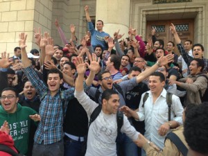 Students victoriously carry Hesham Ashraf, the newly elected head of Cairo University student union, on their shoulders.  (Photo Courtesy of Misr Alqawia students Facebook page) 