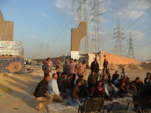 At least 100 workers on strike in Ain Sokhna have suspended a strike on Wednesday that they began earlier this week. (Photo by: Amr Ghonema) 