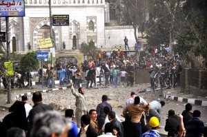 Fighting between Muslim Brotherhood supporters and protesters in front of the Brotherhood’s main headquarters in Moqattam (Photo by: Mohamed Omar)