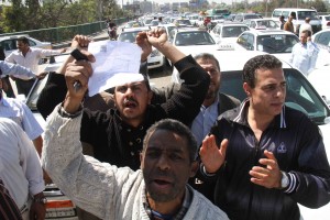Other taxi drivers in the protest were upset that the government had not yet replaced their old black and white taxis with the more recent white cars  (File Photo) (Photo by Ahmed Al-Malky)