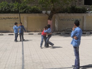 Pupils fight in the playground Ethar Shalaby