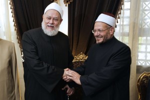 Egypt's newly appointed Grand Mufti Shawqi Abdel Karim (R) meets with his predecessor Ali Gomaa at Al-Azhar compound in Cairo  (AFP Photo)
