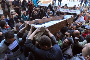 Egyptian protesters carry the body of Mohammed el-Shafi, 24-years-old, during his funeral in the capital Cairo (AFP Photo/ Mohammed Al-Shahed)