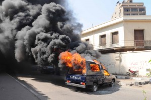 The angry crowd also launched several fireworks, two of them over the police building’s wall, and eventually smashed and set fire to an empty police truck parked outside. (Photo By Ahmed El-Malky)