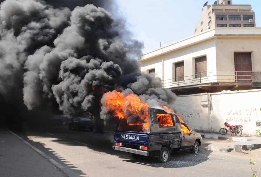 The angry crowd also launched several fireworks, two of them over the police building’s wall, and eventually smashed and set fire to an empty police truck parked outside. (Photo By Ahmed El-Malky)