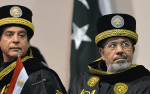 Egyptian President Mohamed Morsi (R) and Pakistani Prime Minister Raja Pervez Ashraf attend a special convocation during his visit the National University of Science and Technology in Islamabad (AFP Photo)