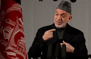 Afghan President Hamid Karzai speaks at a gathering to mark International Women's Day, in Kabul (AFP Photo)