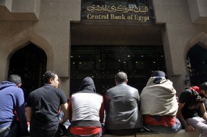 The Ultras surrounded the Central Bank of Egypt in Downtown Cairo early on Sunday preventing employees from entering the building. They also blocked the road to the Cairo International Airport. (Photo by Ahmed El- Malky)