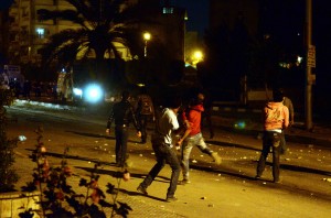 Egyptian protesters clash with riot police in front of the Muslim brotherhood headquarters in Cairo  Last Sunday (Photo by Ahmed Al- Malky)