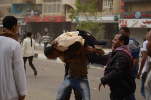Clashes near the Muslim Brotherhood's headquarters in Moqattam on Friday witnessed the injury of at least a dozen journalists covering the incident. (Photo by Ahmed Al-Malky)