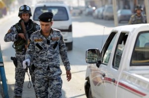 An Iraqi security officer holds a bomb detector device at a checkpoint in central Baghdad. (AFP/File/Ahmad al-Rubaye) 