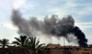 Smoke rises from the site of a car bomb near the Imam Mahdi Islamic Center in Baghdad, on March 29, 2013 (AFP, Sabah Arar) 
