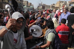 Protesters bang drums and shout anti-Muslim Brotherhood slogans as the 6 April march sets off from the Shubra area of Cairo (Photo By: Mohamed Omar) 