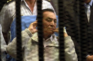Ousted Egyptian president Hosni Mubarak sits behind bars during his retrial at the Police Academy in Cairo on April 15, 2013.  (AFP Photo / Maher Iskander) 
