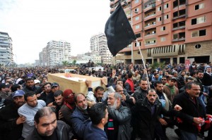 Egyptian mourners carry the coffins of six people killed in clashes the day before, during their funeral in Port Said, on January 28, 2013. President Mohamed Morsi sought to crack down on violence which has swept Egypt since January 26 in which more than 45 people have died after a Cairo court handed down death sentences on 21 supporters of a local football club, Al-Masry, in the wake of football violence in 2012.  (AFP Photo)