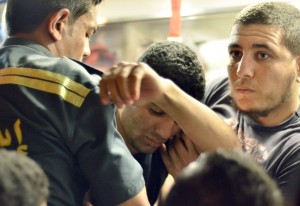 An Egyptian student (C) from the al-Azhar University receives treatment at an ambulance in Cairo late on April 1, 2013 (AFP File Photo)