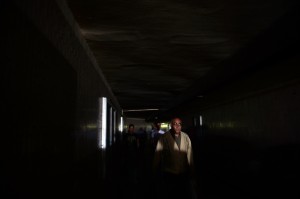 Egyptian passengers walk in the dark following a power cut at the Tahrir Square metro station in Cairo on April 3, 2013 (AFP Photo)