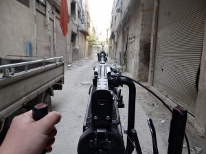A handout picture released by the Syrian opposition's Shaam News Network on April 3, 2013 allegedly shows a rebel fighter aiming his weapon towards the front line in Arbeen in the outskirts of Damascus.  (AFP Photo)