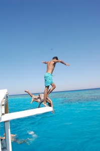 Jumping off the top of the glass bottom boat in the lagoon (Photo by: Joel Gulhane)