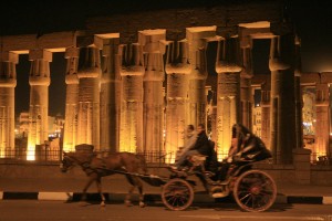 Tourists ride a cart past the Luxor Temple. (AFP FILE PHOTO/KHALED DESOUKI) 