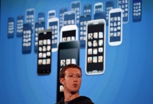 Facebook CEO Mark Zuckerberg speaks during an event on 4 April 2013 at the Facebook headquarters in Menlo Park, California, announcing Facebook ‘Home’. Home will display posts from users’ Facebook news feeds, including messages and photos, instead of the usual menu of apps which are displayed on smartphones like Apple’ iPhone. (AFP Photo/Justin Sullivan/Getty Images) 