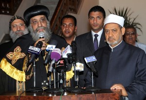 Leader of the Egyptian Coptic Orthodox Church, Pope Tawadros II (L) and Grand Imam of Al-Azhar Sheikh Ahmed al-Tayeb (R) give a joint press conference after a meeting to discuss the current interfaith situation at the Egyptian Coptic Cathedral in Cairo's Abbassiya neighbourhood on April 26, 2013, following clashes between Christians and Muslims earlier in the month (AFP Photo)