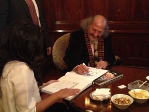 George Bahgory signed the book of his drawings during the event (Photo by: Thoraia Abou Bakr)