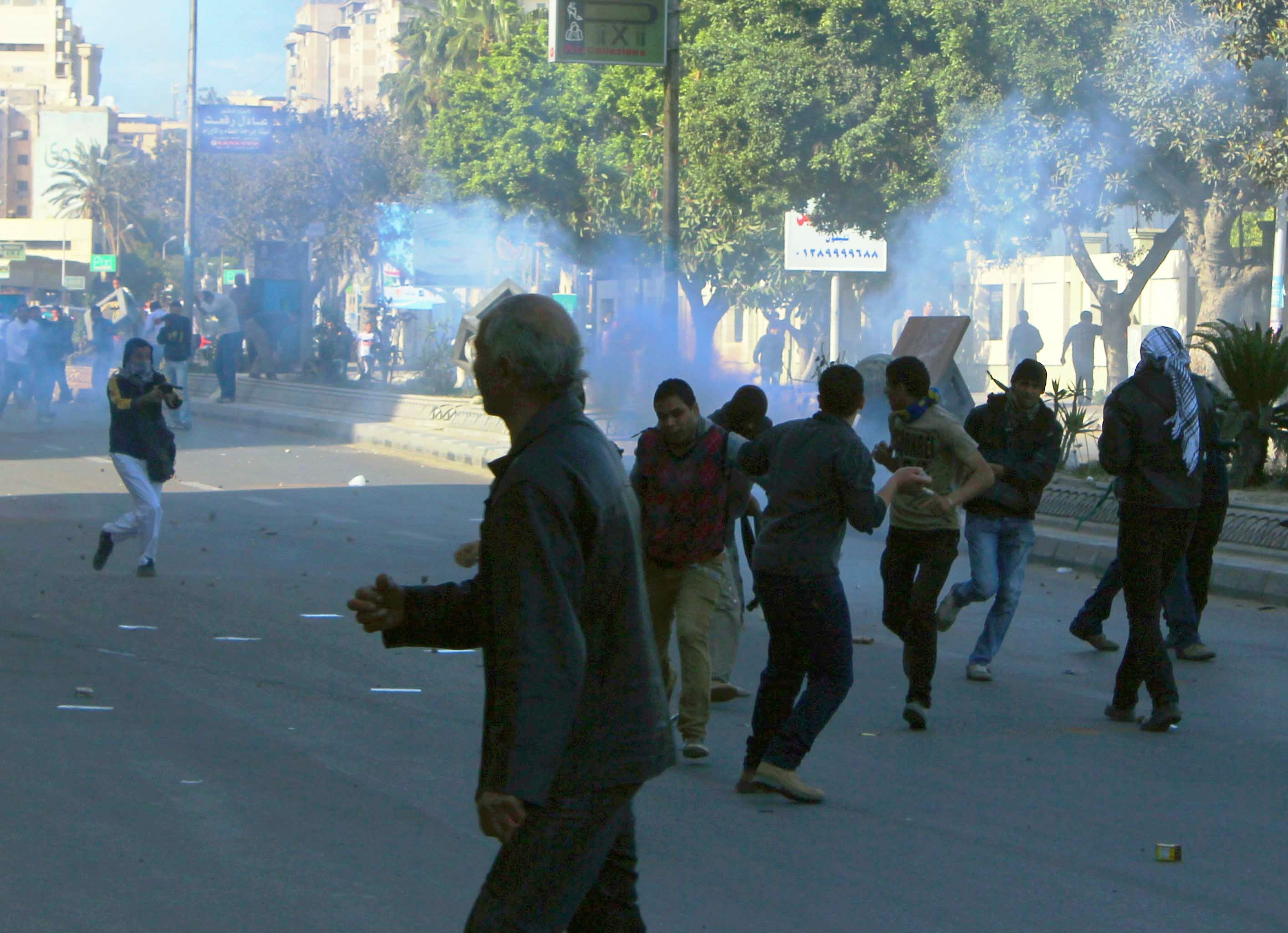 A member of the Muslim Brotherhood firing buckshot at protesters in Alexandria (Photo by Ahmed Arab)