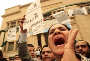 Egyptian activists shout slogans during a protest outside the lawyers' syndicate in downtown Cairo, after it was hit by a strong sandstorm, on April 6, 2008.  (AFP File Photo)