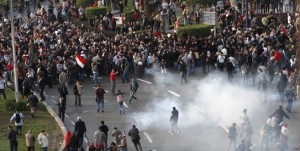 Egyptian demonstrators protest in central Cairo amidst tear gas fire by Egyptian police to demand the ouster of President Hosni Mubarak and calling for reforms on January 25, 2011. (AFP File Photo)