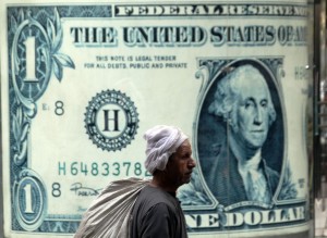 The Central Bank of Egypt (CBE) decided on Tuesday to stabilise the dollar price after two increases on Thursday and Sunday, when the dollar increased by 20 piasters. (AFP Photo) 