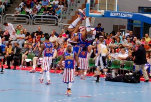 'Hammer' hangs upside down from the hoop during a performance of the Harlem Globetrotters in Cairo International Indoor Stadium on May 10, 2013. (Photo by: Emily Crane) 
