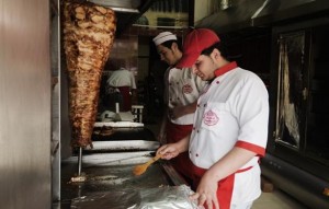 Syrian refugees work in a kitchen in the 6th of October neighbourhood of Cairo  (AFP Photo / Gianluigi Guercia) 