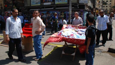 Street vendors occupy marked out stall positions near Talaat Harb Street in Downtown Cairo in August 2012 (Photo by: Mohamed Omar) 