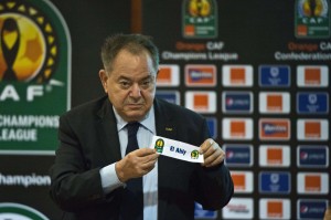 A member of the Confederation of African Football (CAF) shows the name of Egypt's Al-Ahly football team during the CAF Champions League draw in Cairo on May 14, 2013.  Al-Ahly  is on group A and will play against Egypt's Zamalek.  (AFP Photo / Khaled Desouki) 
