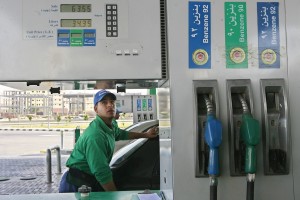 An Egyptian worker fills a car with petrol at a gas station in Cairo  (AFP Photo)