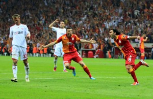 Galatasara's Burak Yilmaz (2nd R) and Selcuk Inan (R) celebrate their goal against Sivasspor during the Turkish super league match between Galatasay and Sivasspor on May 5, 2013 at Turk Telekom Arena, in Istanbul. (AFP Photo\ Mira)