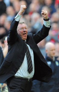 A file picture taken on April 5, 2009, shows Manchester United manager Alex Ferguson celebrating after victory over Aston Villa in Manchester. (AFP File Photo)