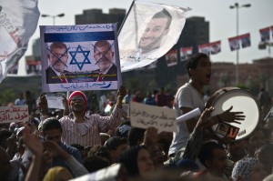 Egyptian protesters march towards Egypt's landmark Tahrir square during a demonstration against President Mohammed Morsi on May 17, 2013 in Cairo. (AFP Photo)