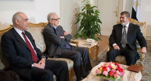 A handout picture released by the Egyptian presidency shows Egypt's President Mohamed Morsi (R) and his Foreign Minister Mohamed Kamel Amr (L) meeting with UN-Arab League envoy for Syria Lakhdar Brahimi in Cairo on May 20, 2013.(AFP PHOTO / HO / EGYPTIAN PRESIDENCY)