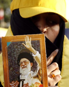 A Lebanese woman and supporter of Hezbollah holds a picture of Iran's supreme leader Ayatollah Ali Khamenei in Mashghara in the western Bekaa Valley on May 25, 2013 during a ceremony marking the 13th anniversary of Israel's military withdrawal from Lebanon. (AFP Photo)
