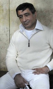 A file photo dated February 23, 2011 shows Egyptian businessman Ahmed Ezz behind bars during a hearing of his trial on suspicion of diverting public funds in Cairo. (AFP File Photo)