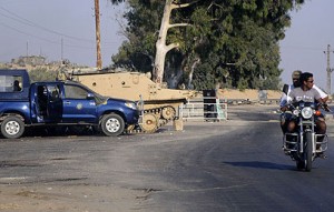 Armed men fired at a police checkpoint at the entrance to the port of Al-Arish on Sunday night (AFP Photo)