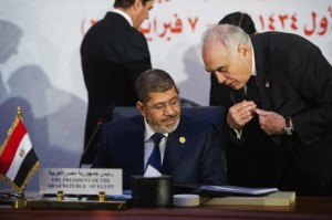 President Mohamed Morsi and Foreign Minister Mohamed kamel Amr were at the OIC summit in Cairo last February. (AFP File Photo) 
