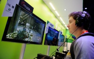 A visitor tries out the Microsoft Xbox 360 at the 2012 International Consumer Electronics Show in Las Vegas (AFP File Photo) 